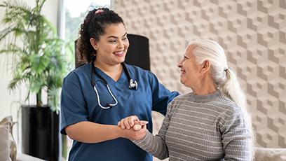 An image of a woman healthcare worker with an elderly woman.