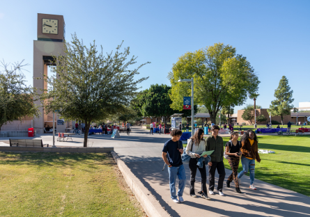 A small group of MCC students walking through the campus