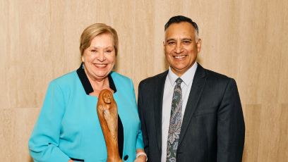 An image of MCCCD Governing Board Member At-large Dr. Linda Thor holding an award and MCCCD Chancellor Dr. Dr. Steven R. Gonzales