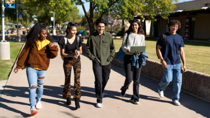 A group of students walking across the campus.
