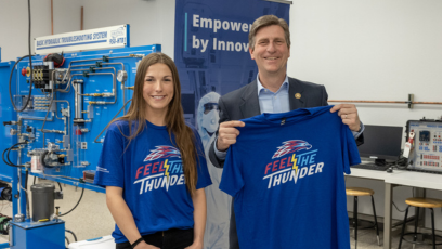 Congressman Greg Stanton visited Mesa Community College's nursing and advanced manufacturing labs. He's pictured with a MCC student hold a MCC T-shirt.