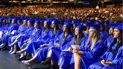 Rio Salado College students wearing graduation caps and gowns attending the 2024 commencement ceremony.  