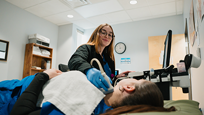 A GateWay Community Colleges Healthcare United at GateWay student providing a ultrasound to a patient.