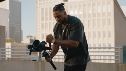 Shawn Deloney is holding a camera shooting b-roll