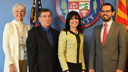 An image of Augustine Bartning with MCCCD Governing Board members, MCCCD Chancellor Harper-Marinick