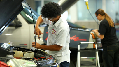 An image of automotive CTE students working on cars