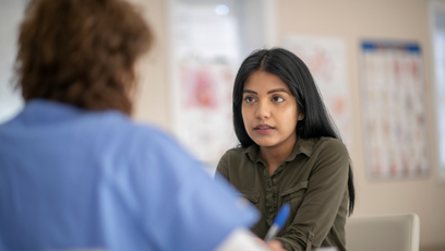 Image of a woman talking to a healthcare professional