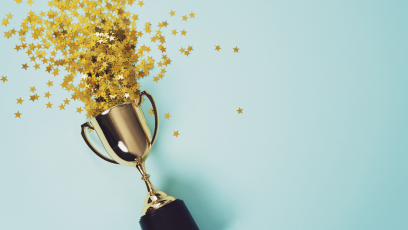 Image of a trophy with stars on a light blue background