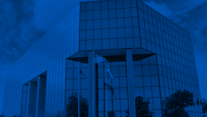 Dark blue exterior image of the Maricopa County Community College District office building in Tempe