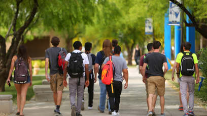 Image of students walking on a college campus