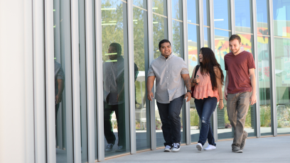 An image of three students walking together