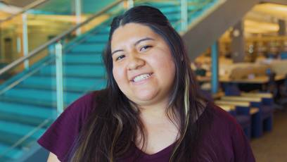 An image of a smiling female HSI EXCELlence student wearing a maroon shirt 