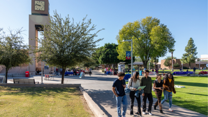 A small group of MCC students walking through the campus