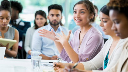 An image of a group of people at a meeting