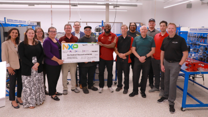 NXP, Mesa Community College and Estrella Mountain Community College representative holding a large NXP check for $100,000.