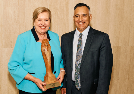 An image of MCCCD Governing Board Member At-large Dr. Linda Thor holding an award and MCCCD Chancellor Dr. Dr. Steven R. Gonzales