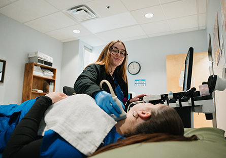 A GateWay Community Colleges Healthcare United at GateWay student providing a ultrasound to a patient.