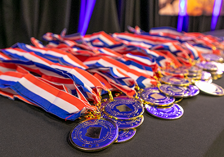 All-Arizona Academic Team medals displayed on a table.