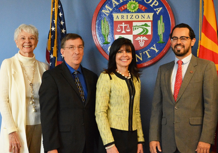 An image of Augustine Bartning with MCCCD Governing Board members, MCCCD Chancellor Harper-Marinick