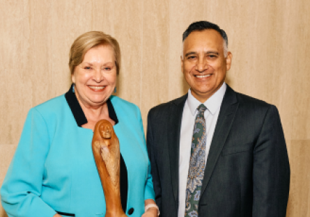 An image of MCCCD Governing Board Member At-large Dr. Linda Thor holding an award and MCCCD Chancellor Dr. Dr. Steven R. Gonzales