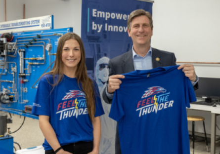 Congressman Greg Stanton visited Mesa Community College's nursing and advanced manufacturing labs. He's pictured with a MCC student hold a MCC T-shirt.