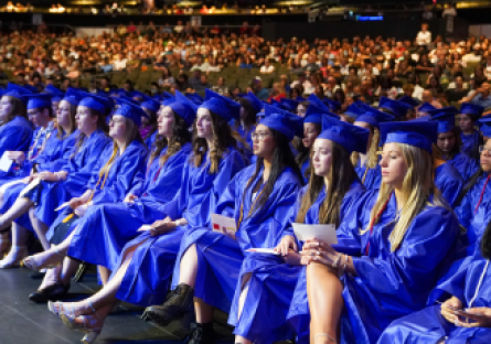 Rio Salado College students wearing graduation caps and gowns attending the 2024 commencement ceremony.  