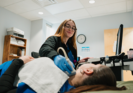 A GateWay Community Colleges Healthcare United at GateWay student providing a ultrasound to a patient.