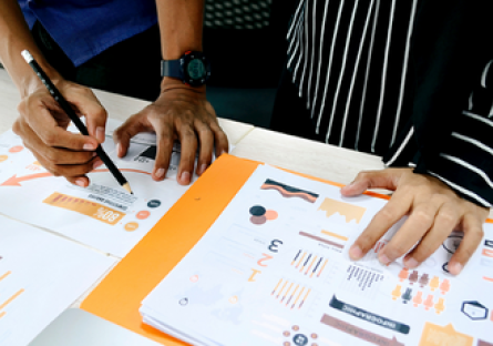 Hands reviewing data
