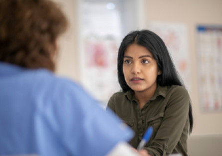 Image of a woman talking to a healthcare professional