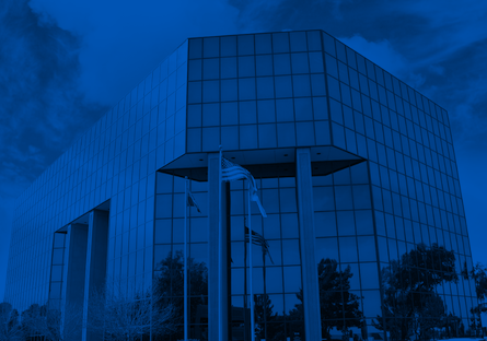 Dark blue exterior image of the Maricopa County Community College District office building in Tempe