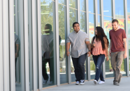 An image of three students walking together