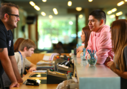 An image of students making an appointment at academic advising