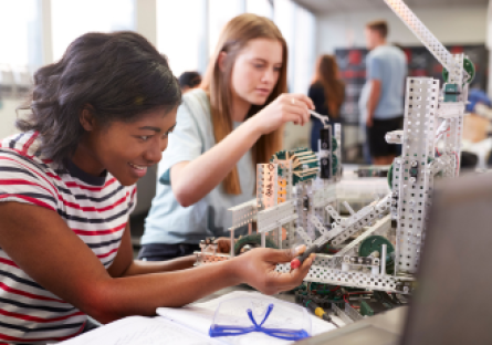 An image of two female students working together on an engineering project