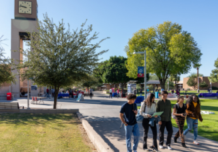 A small group of MCC students walking through the campus