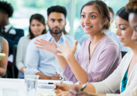 An image of a group of people at a meeting