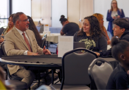 U.S. Secretary of Education Dr. Miguel A. Cardona meets with South Mountain Community College students during the college's FAFSA workshop